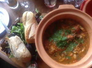 spicy fish stew with butter poached pepper sauce, mixed fish, prawns and mussels in aromatic sauce with warm baguette